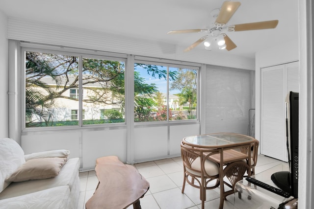 sunroom featuring ceiling fan