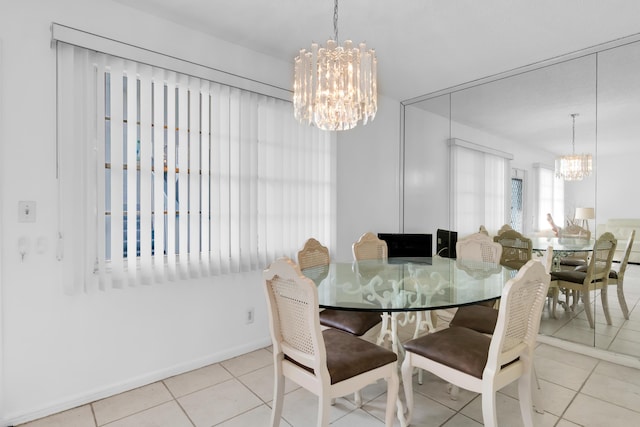 tiled dining area featuring a notable chandelier