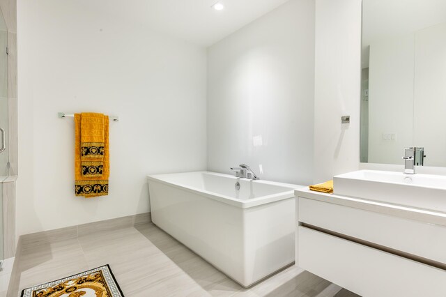 bathroom featuring vanity and a bathtub