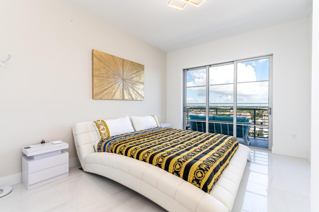 bedroom featuring tile patterned floors and access to exterior