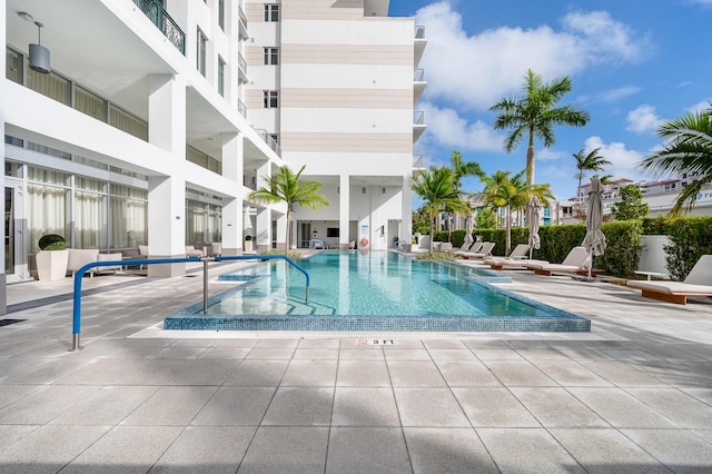 view of swimming pool featuring a patio