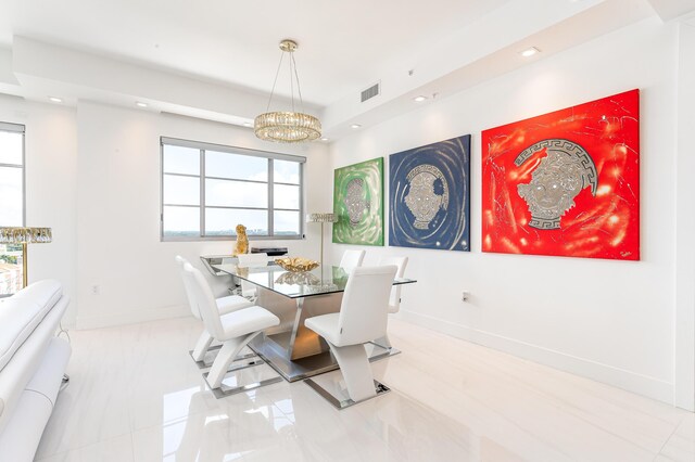 dining space featuring an inviting chandelier