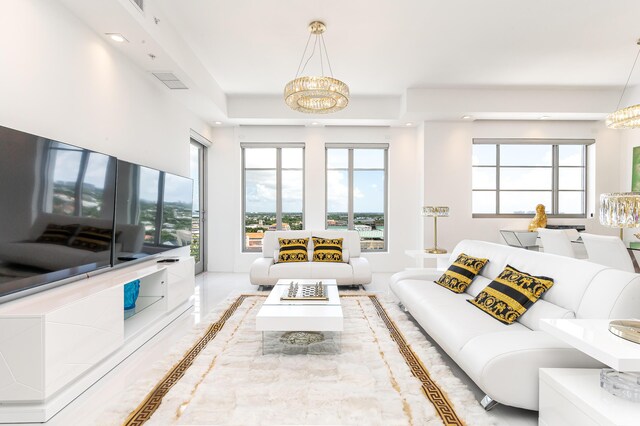 living room featuring a notable chandelier