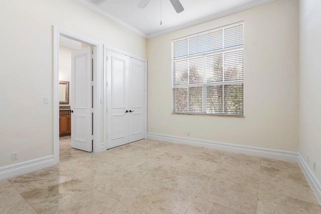 unfurnished bedroom with ceiling fan, crown molding, and a closet