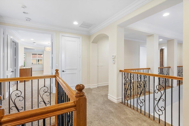 hall with carpet flooring and crown molding