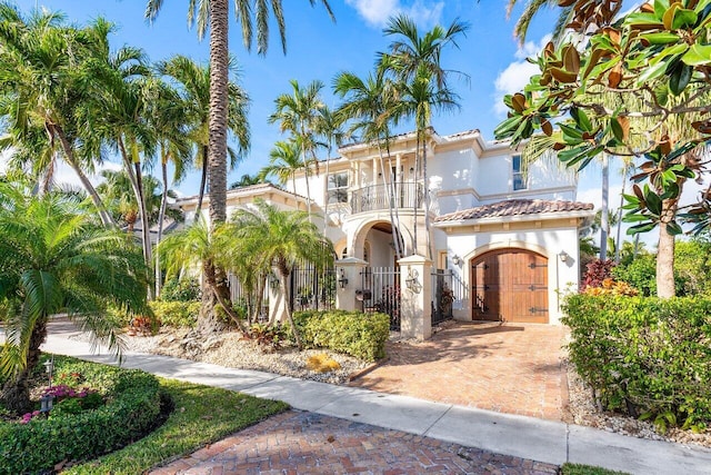 mediterranean / spanish home featuring a balcony