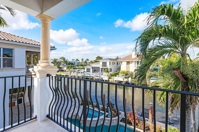 balcony featuring a water view