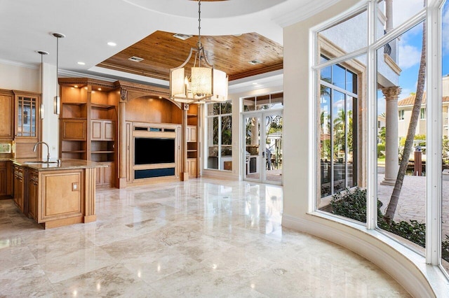 unfurnished living room with a chandelier, crown molding, wooden ceiling, and sink