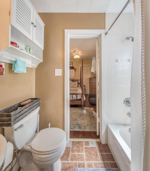 bathroom with hardwood / wood-style flooring, shower / bath combination with curtain, and toilet