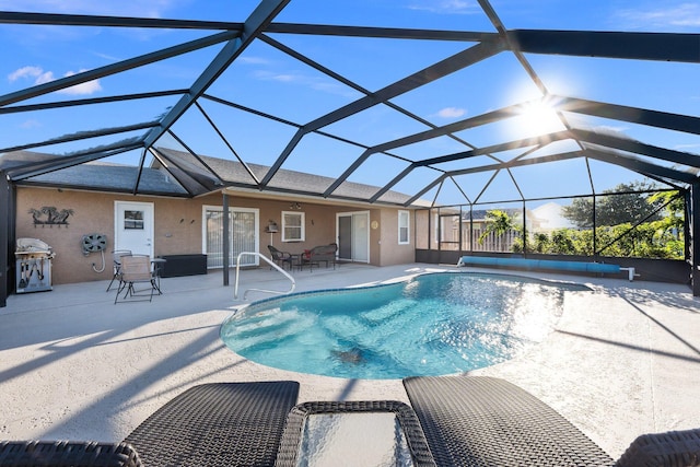 view of pool featuring a patio and a lanai