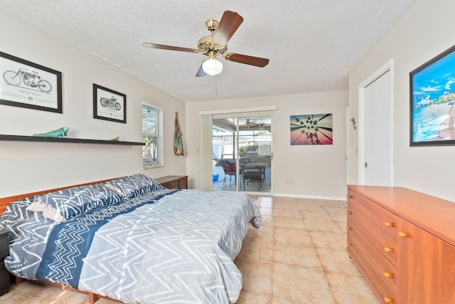 bedroom with access to exterior, light tile patterned floors, a textured ceiling, and ceiling fan