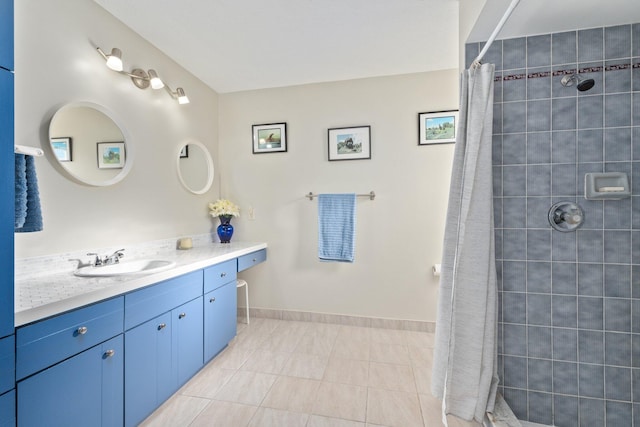 bathroom with tile patterned floors, a shower with curtain, and vanity