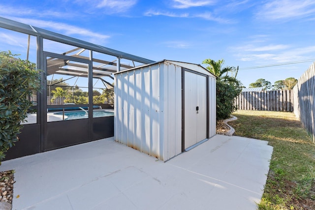 view of outdoor structure featuring a fenced in pool