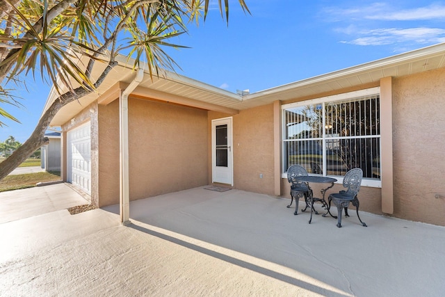 view of patio / terrace featuring a garage