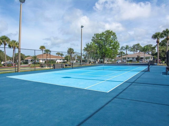 view of sport court featuring basketball hoop