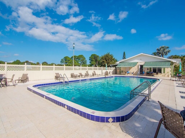 view of swimming pool with a patio area