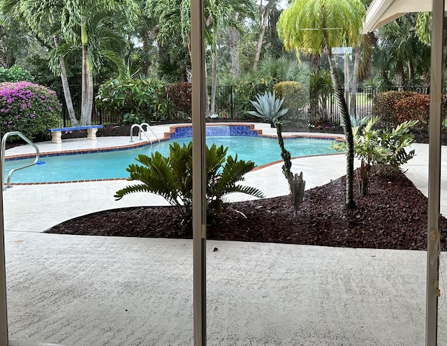 view of swimming pool with a patio