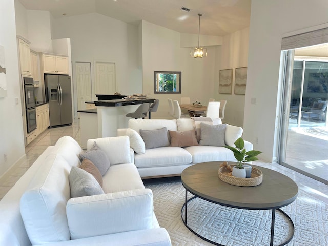 1627 Mayacoo Lakes Blvd, West Palm Beach, FL 33411 - living room with high vaulted ceiling and a chandelier