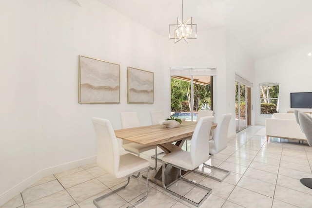 1627 Mayacoo Lakes Blvd, West Palm Beach, FL 33411 - dining space with a chandelier, light tile patterned floors, high vaulted ceiling, and baseboards
