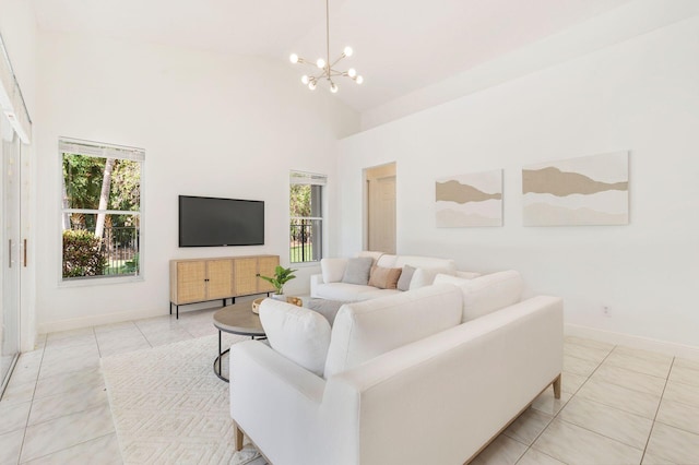 1627 Mayacoo Lakes Blvd, West Palm Beach, FL 33411 - living room featuring high vaulted ceiling, a chandelier, light tile patterned floors, and baseboards