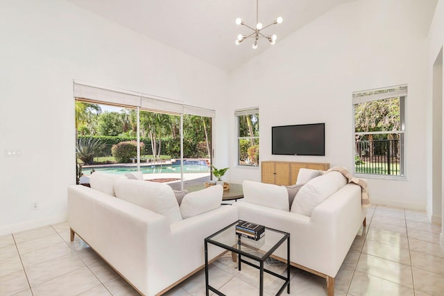 1627 Mayacoo Lakes Blvd, West Palm Beach, FL 33411 - living area with high vaulted ceiling, baseboards, light tile patterned flooring, and a chandelier