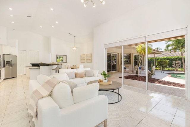 1627 Mayacoo Lakes Blvd, West Palm Beach, FL 33411 - living area with high vaulted ceiling, a chandelier, light tile patterned floors, and recessed lighting