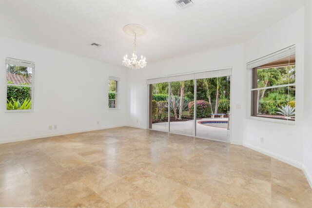 empty room with a chandelier