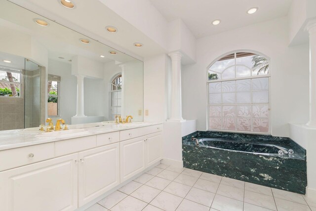 bathroom featuring tile patterned floors, vanity, toilet, and a tile shower