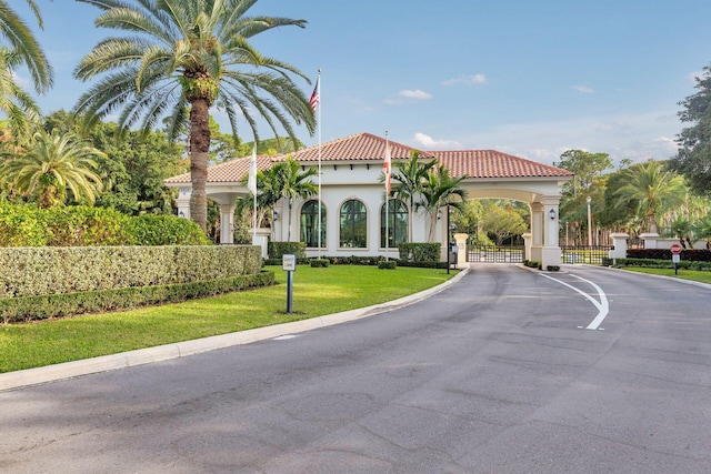 mediterranean / spanish-style home with a front lawn