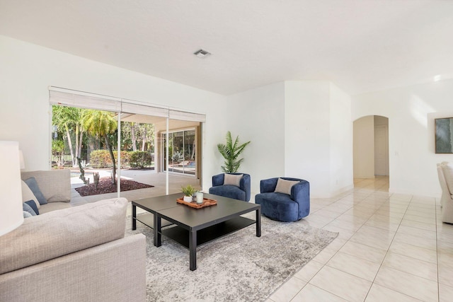 1627 Mayacoo Lakes Blvd, West Palm Beach, FL 33411 - living area featuring arched walkways and light tile patterned flooring