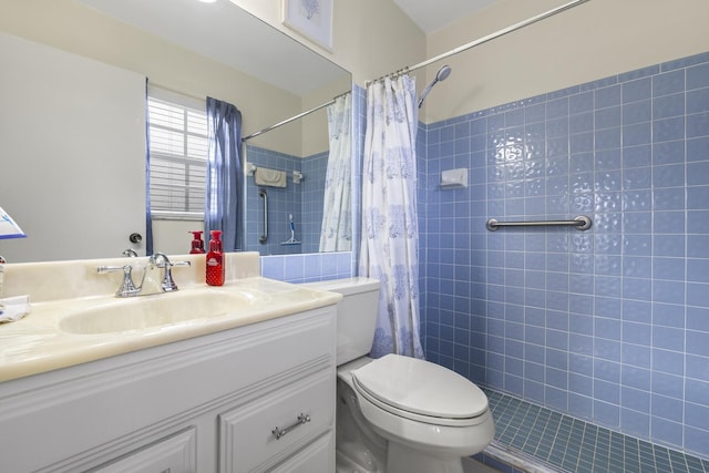 bathroom with vanity, toilet, and walk in shower