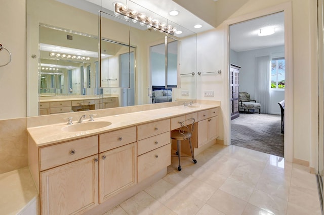 bathroom featuring tile patterned flooring and vanity