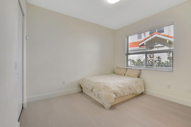 bedroom with wood-type flooring