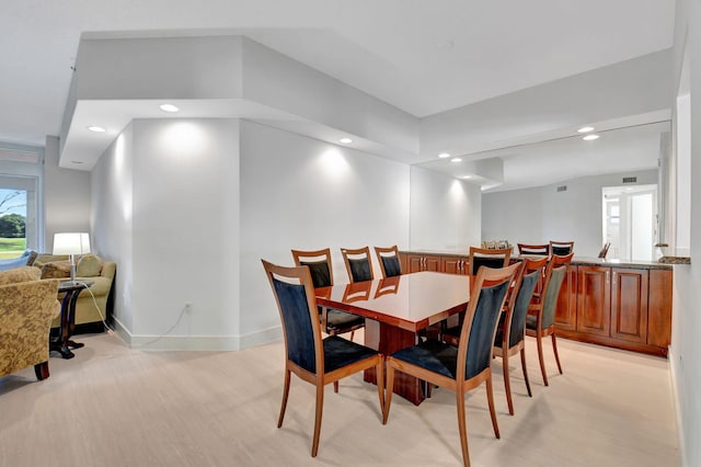 dining area featuring light wood-type flooring