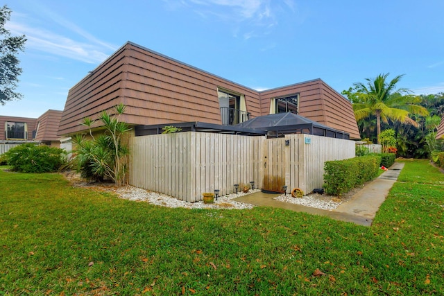 view of home's exterior with a lawn