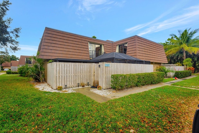 view of side of property with a yard