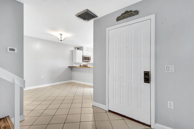 interior space with light tile patterned flooring