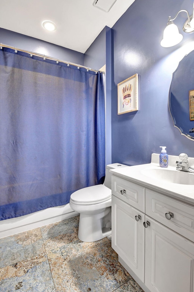 bathroom with vanity and toilet