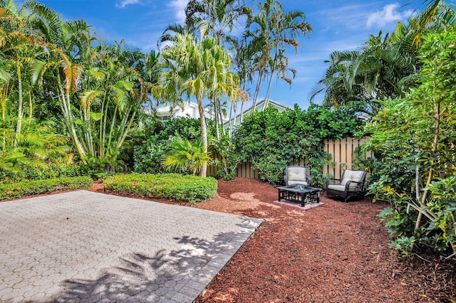 view of yard featuring a patio and a fire pit