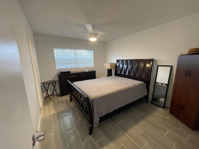 bedroom with hardwood / wood-style flooring and ceiling fan