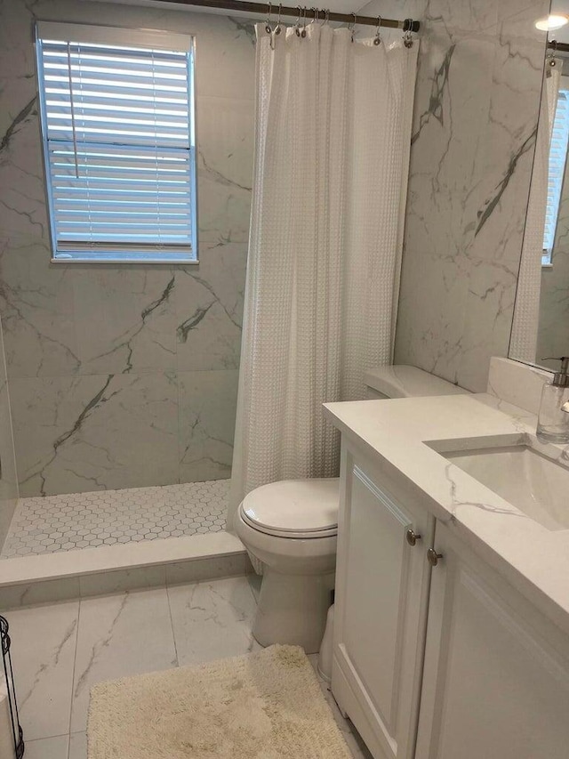 bathroom with vanity, toilet, and curtained shower