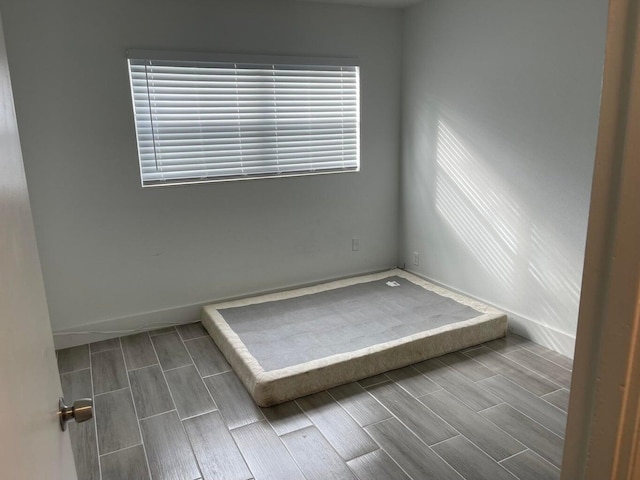 unfurnished bedroom with hardwood / wood-style floors