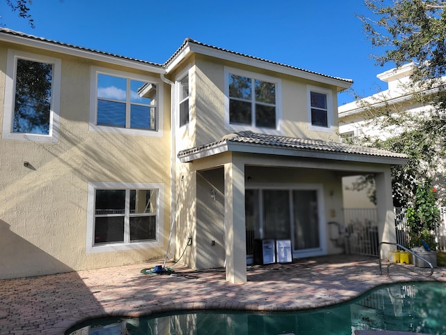 rear view of house featuring a patio area