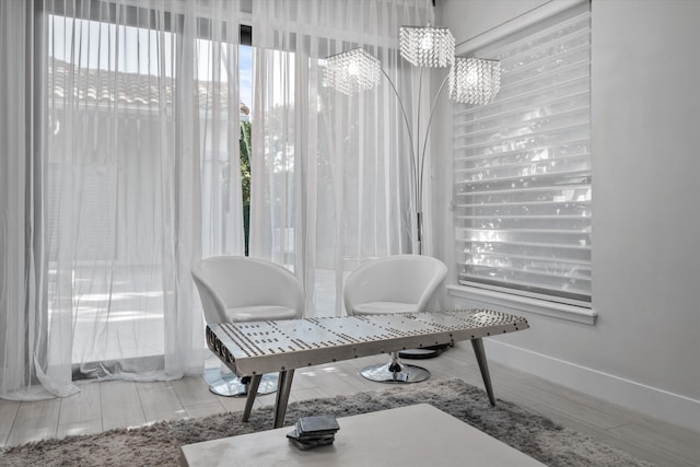 interior space with an inviting chandelier and light wood-type flooring