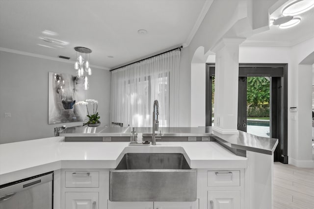 kitchen featuring white cabinets, crown molding, sink, stainless steel dishwasher, and light wood-type flooring