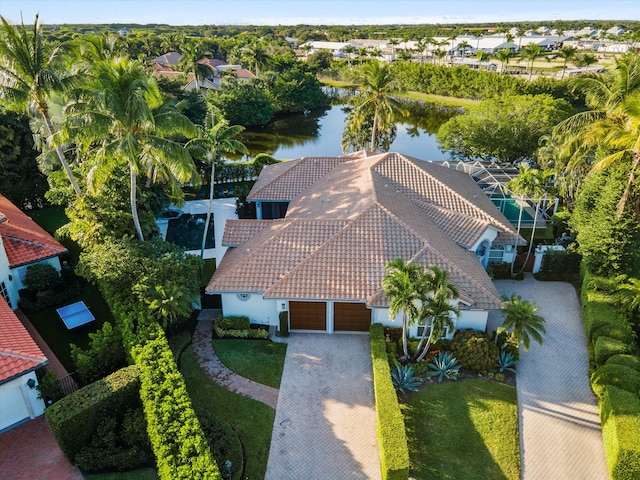 birds eye view of property with a water view