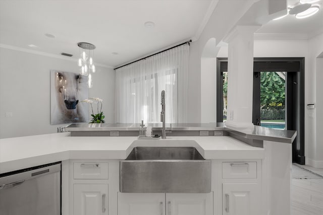 kitchen featuring white cabinets, stainless steel dishwasher, crown molding, and sink