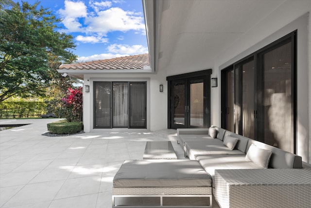 view of patio with outdoor lounge area and french doors