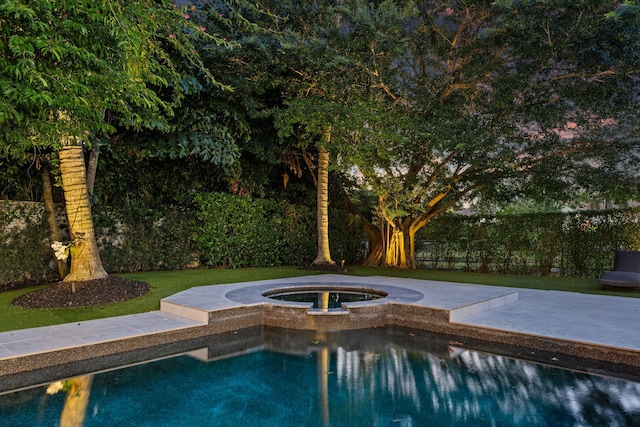 view of swimming pool featuring an in ground hot tub