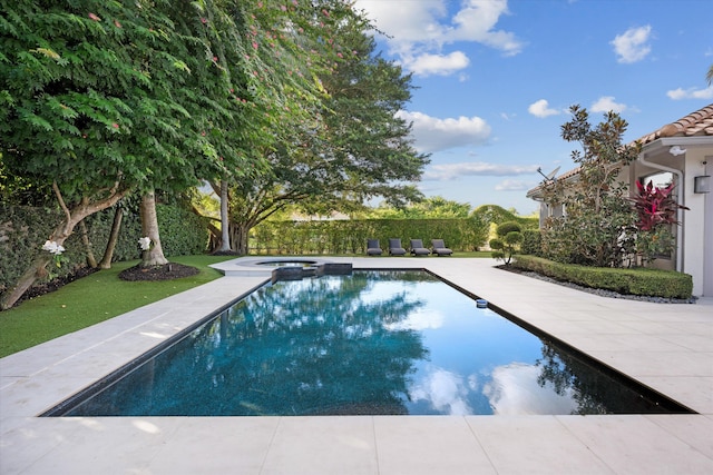 view of pool featuring an in ground hot tub and cooling unit